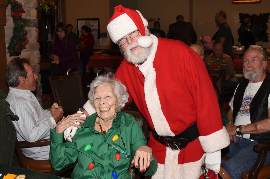 Resident Poses with Santa Clause at Colorado Retirement Community
